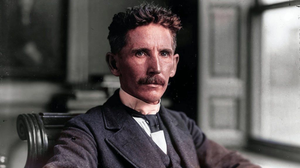 A portrait of young Nikola Tesla, exuding brilliance and a visionary aura, symbolizing his innovative genius. Budhiraja Official Podcast